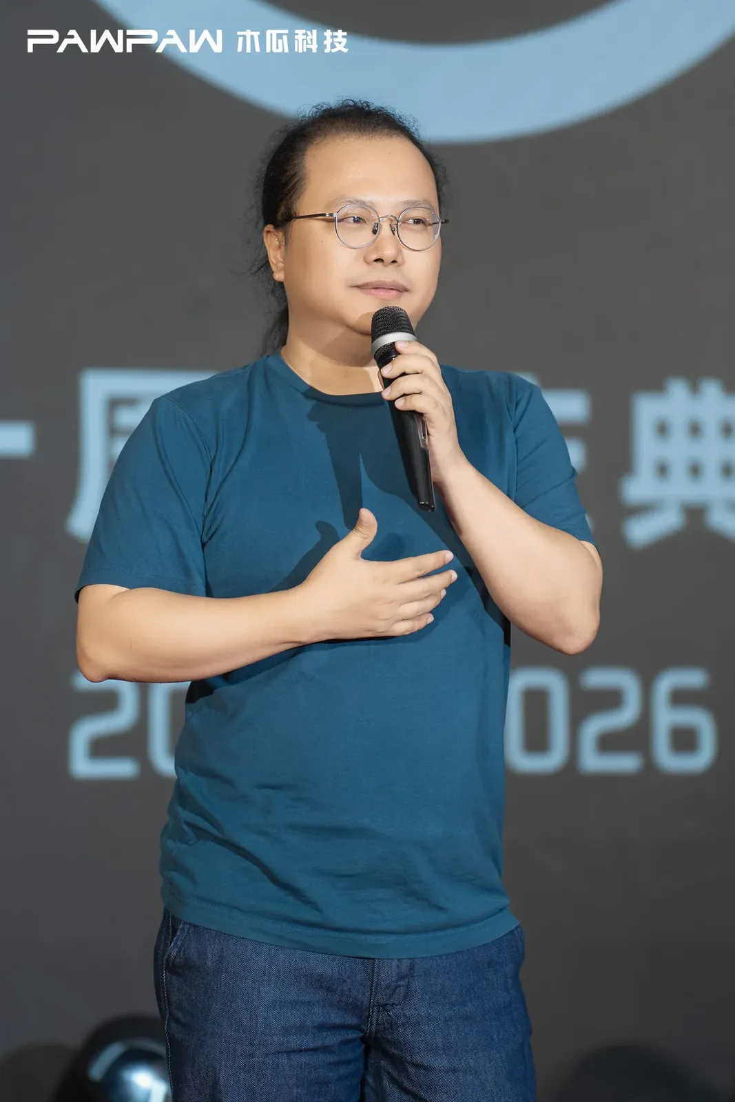 A partner representative speaking at the anniversary celebration